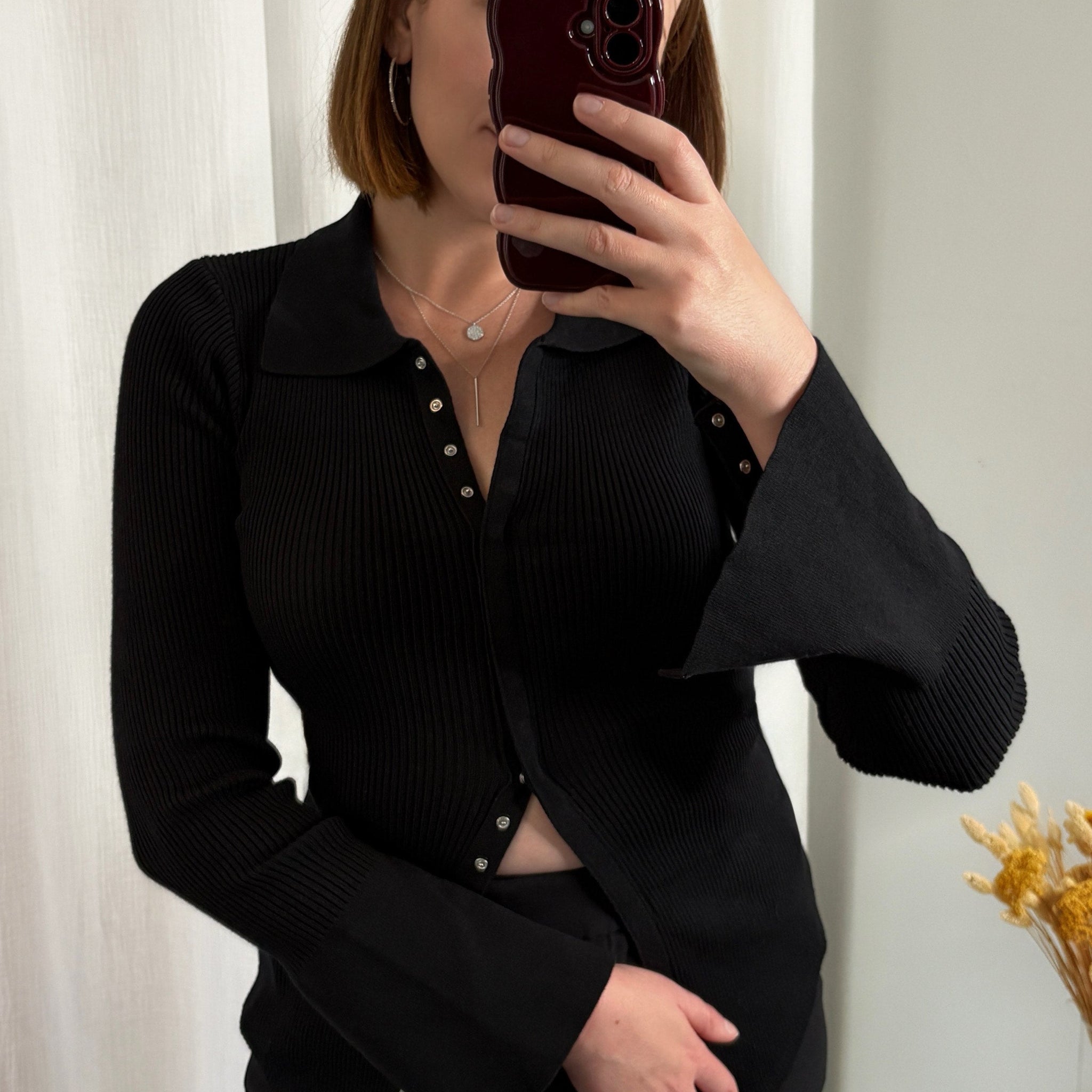 Pull noir à boutons