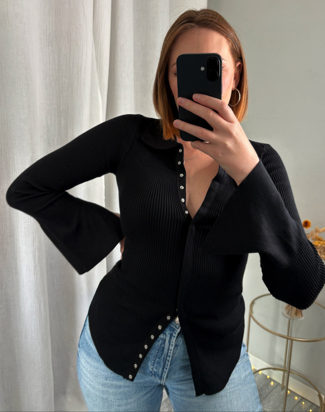 Pull noir à boutons